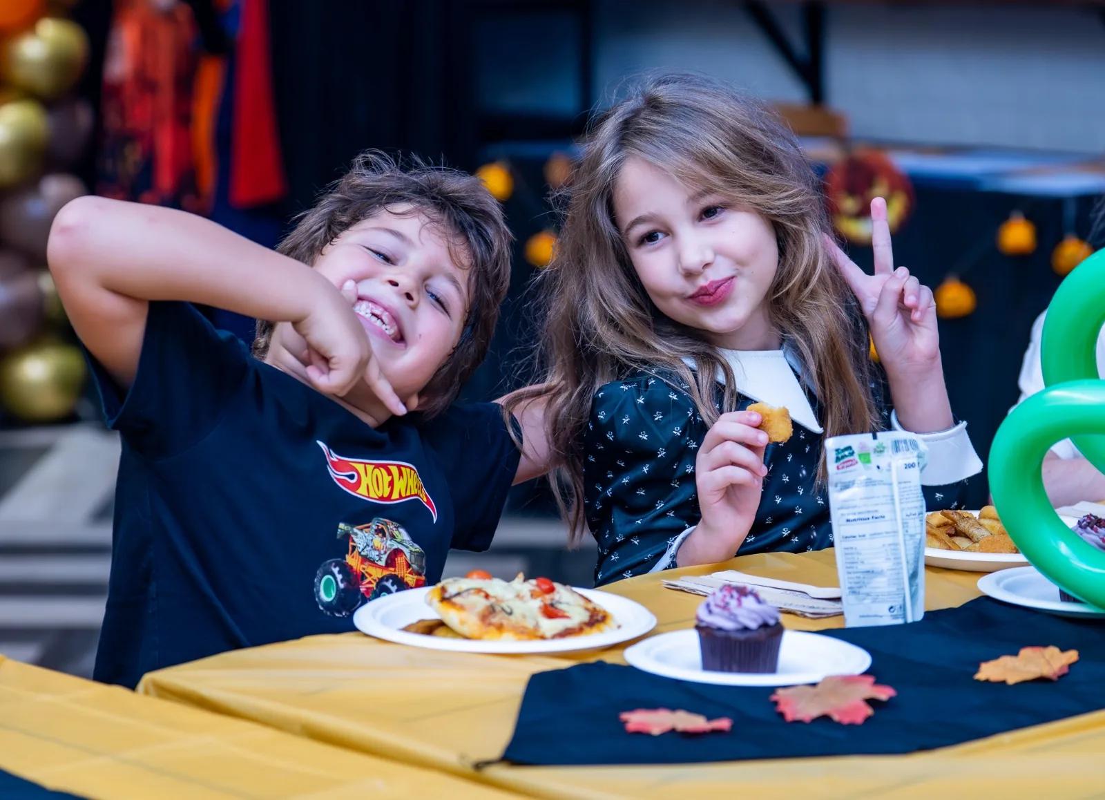 Two kids at the Halloween Party
