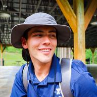 A photo of CampAds founder, Cullan McNamara, working at a YMCA camp
