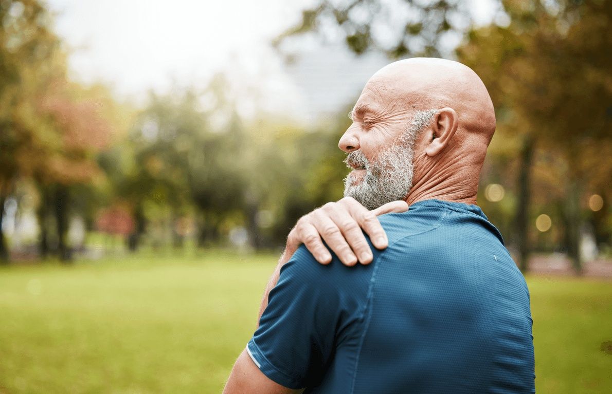 Senior man exercising outside has shoulder pain, highlighting the need for arthroscopic surgery with the best orthopedic surgeon in San Francisco, CA