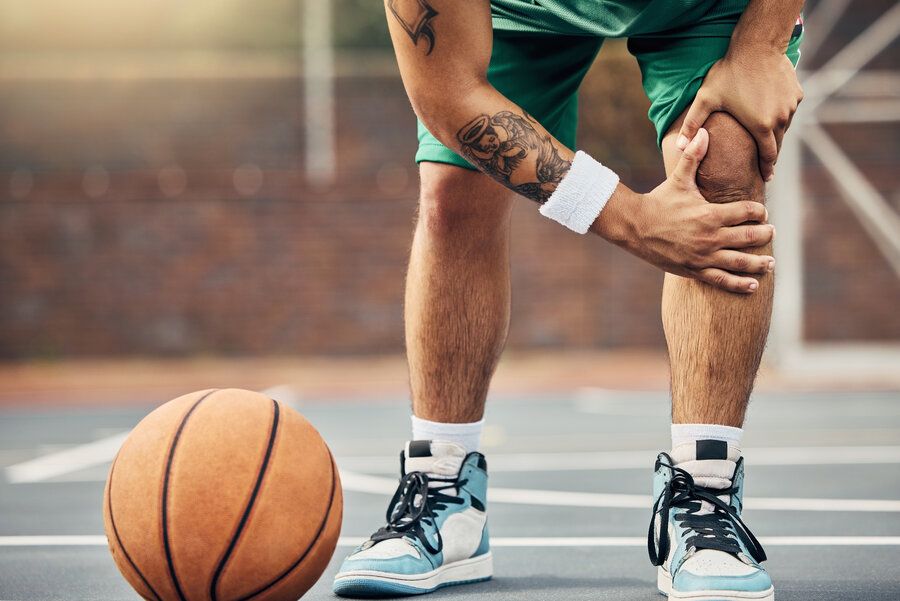 Man hurts knee on basketball court may need ACL reconstruction surgery
