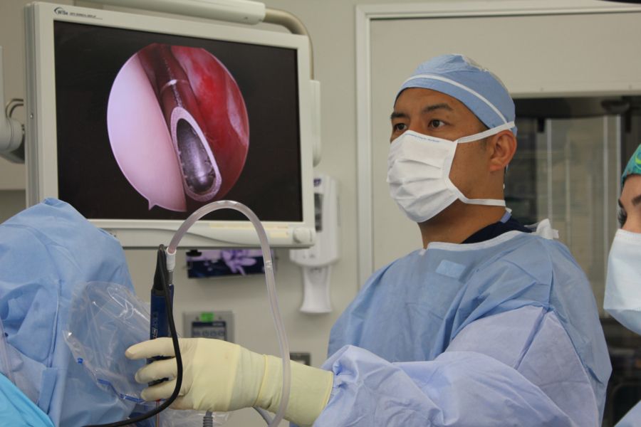 Orthopedic surgeon, Dr. James Chen, performing ankle injury treatment with arthroscopic ankle surgery equipment, as the best ankle specialist in San Francisco