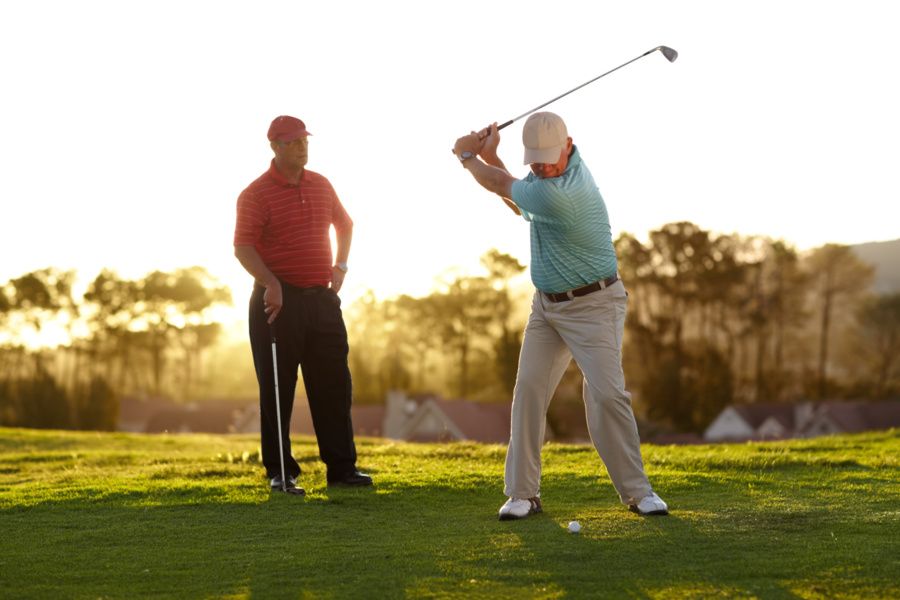 Man practicing a golf swing on the course, representing recovery after minimally invasive rotator cuff repair by the best orthopedic surgeon in San Francisco, CA.