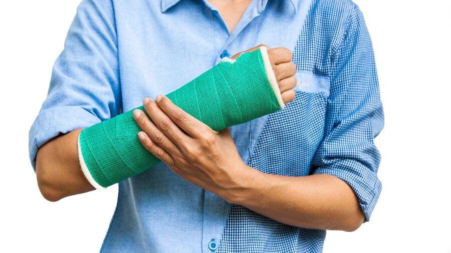 green cast on a woman's broken arm orthopedic surgeon in San Francisco can help