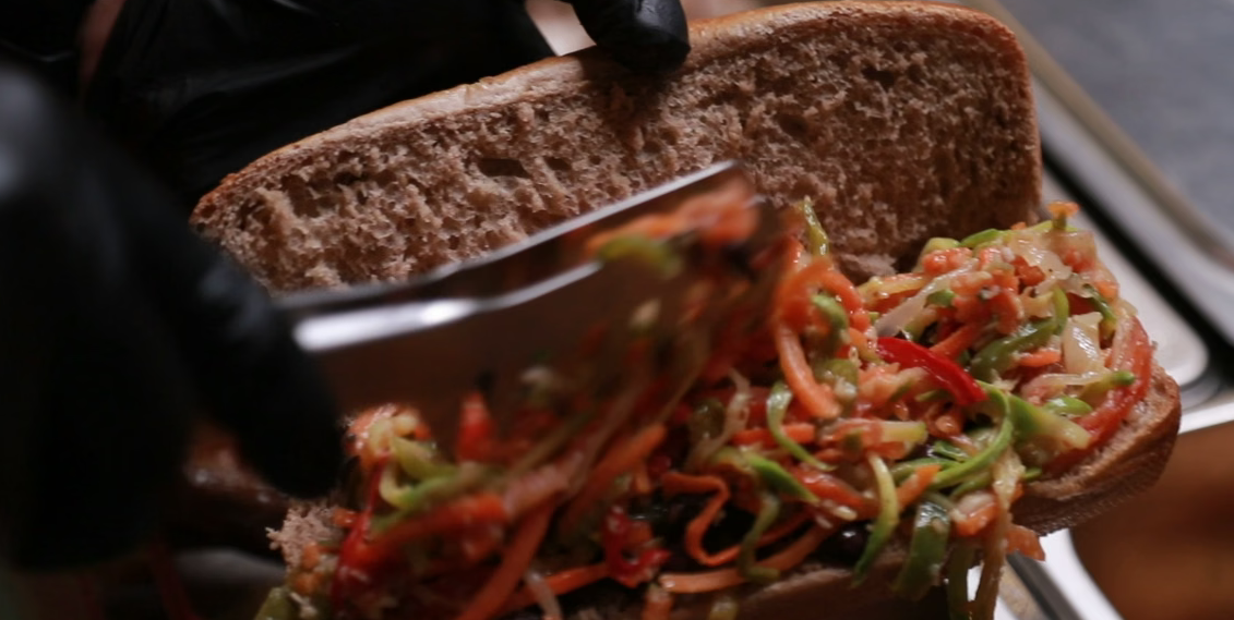 Chef making a brisket sandwich