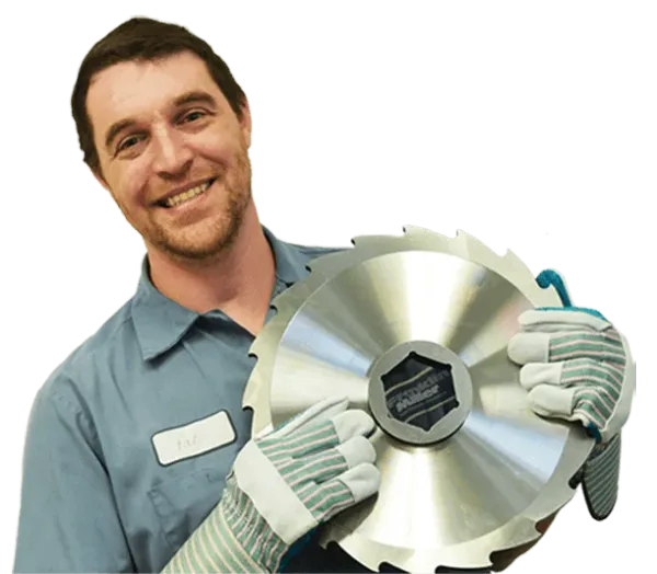 A man holding a large circular cutter blade