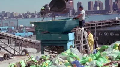 man with backhoe city skyline