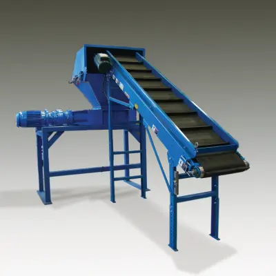 TASKMASTER TM1600 industrial shredder on a stand with a feed hopper and inclined infeed conveyor