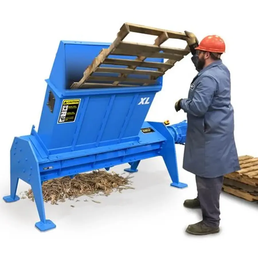 man operating pallet shredder