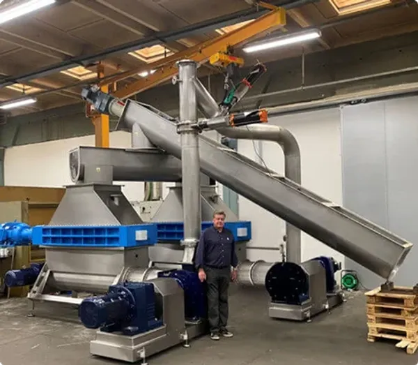 Taskmaster Electronic Waste Shredder Being Fed By Screw Conveyor