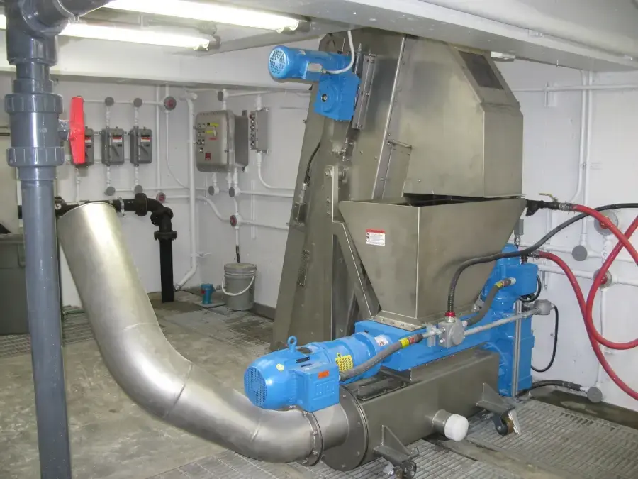 SPIRALIFT SC screenings washer and compactor installed on a concrete operating floor