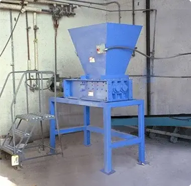 An industrial shredder installation in a building
