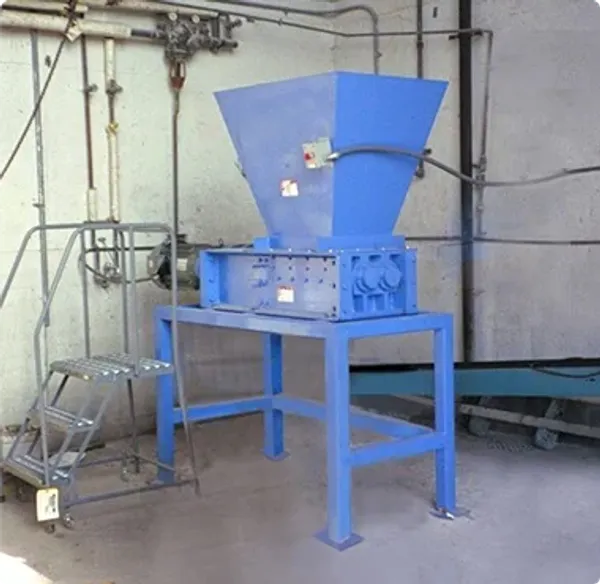 An industrial shredder installation in a building