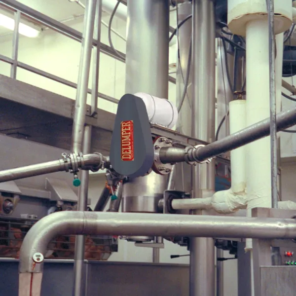 An industrial crusher installed inline at a warehouse