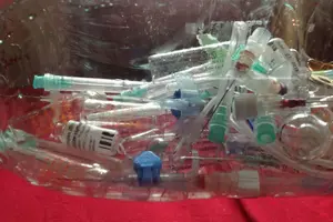 pile of disposed medical syringes