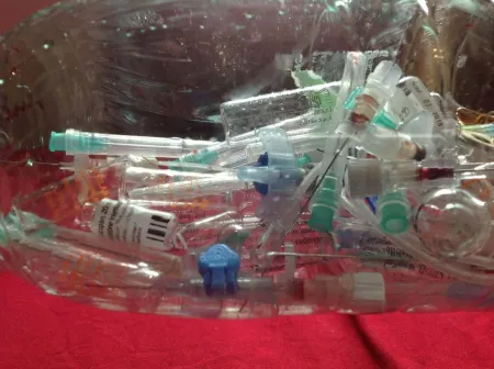 pile of disposed medical syringes