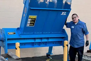 man with large pallet shredder