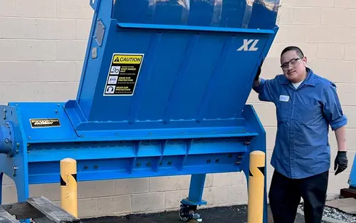 man with large pallet shredder