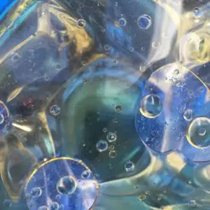 A closeup picture of bubbles in a liquid