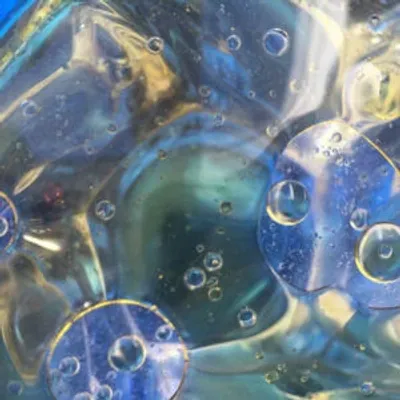 A closeup picture of bubbles in a liquid