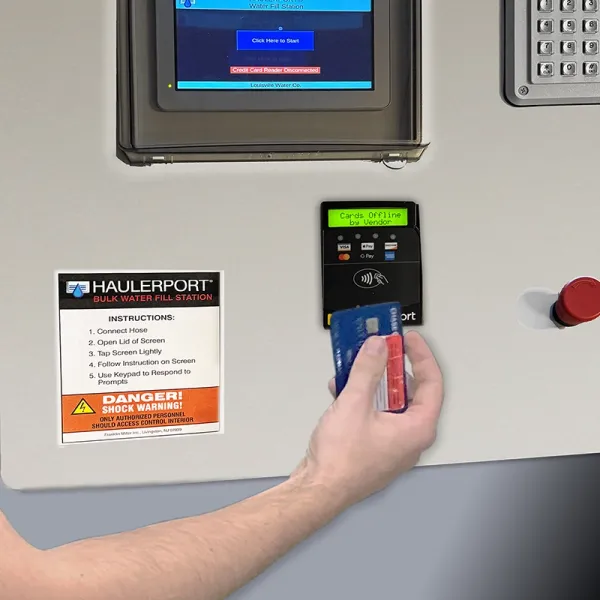 Person using debit card at pay station
