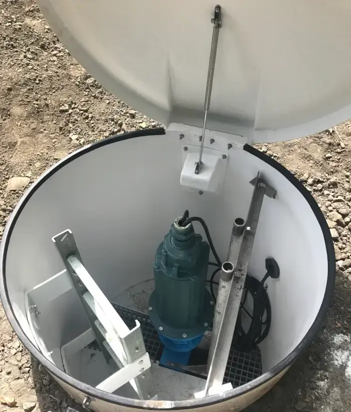 TASKMASTER grinder installed inside a prefabricated fiberglass manhole package