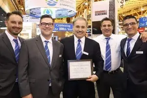 group of men with certificate
