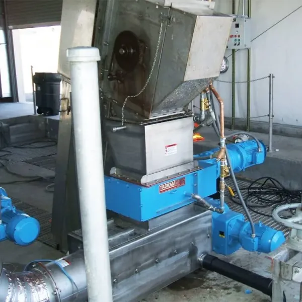 An installation of an industrial shredder and screening equipment