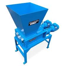 The Taskmaster QS2400 Quad Shredder with hopper and four shafts for precise sizing.