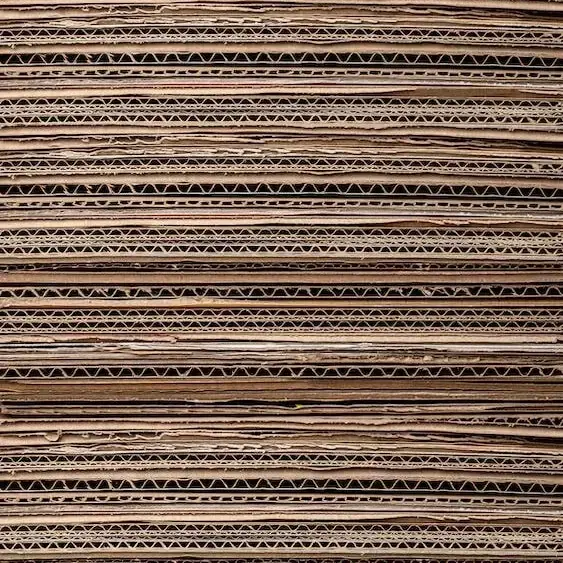 A stack of flattened cardboard pieces