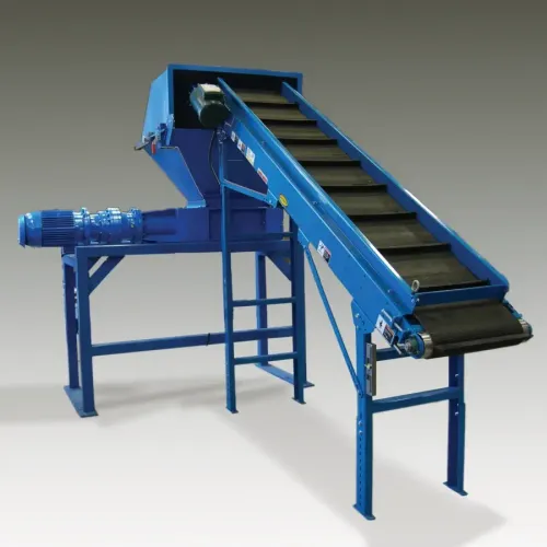 An industrial shredder with a conveyor attachement