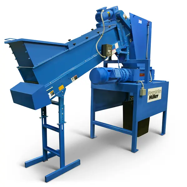 An industrial document shredder with a conveyor attachment