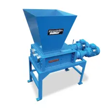 TASKMASTER QS2400 quad-shaft shredder with a feed hopper, mounted on a stand with two drive motors on one side