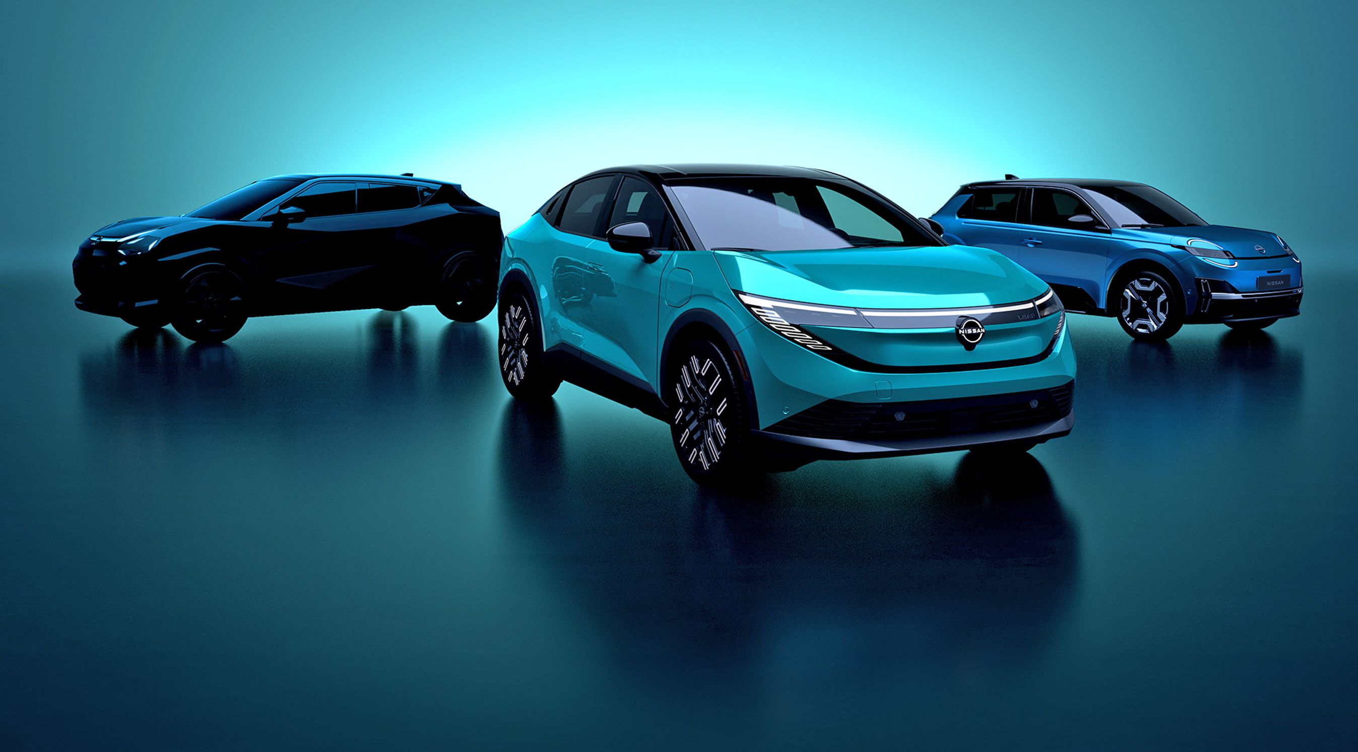 Tre elbiler i dunkel belysning.