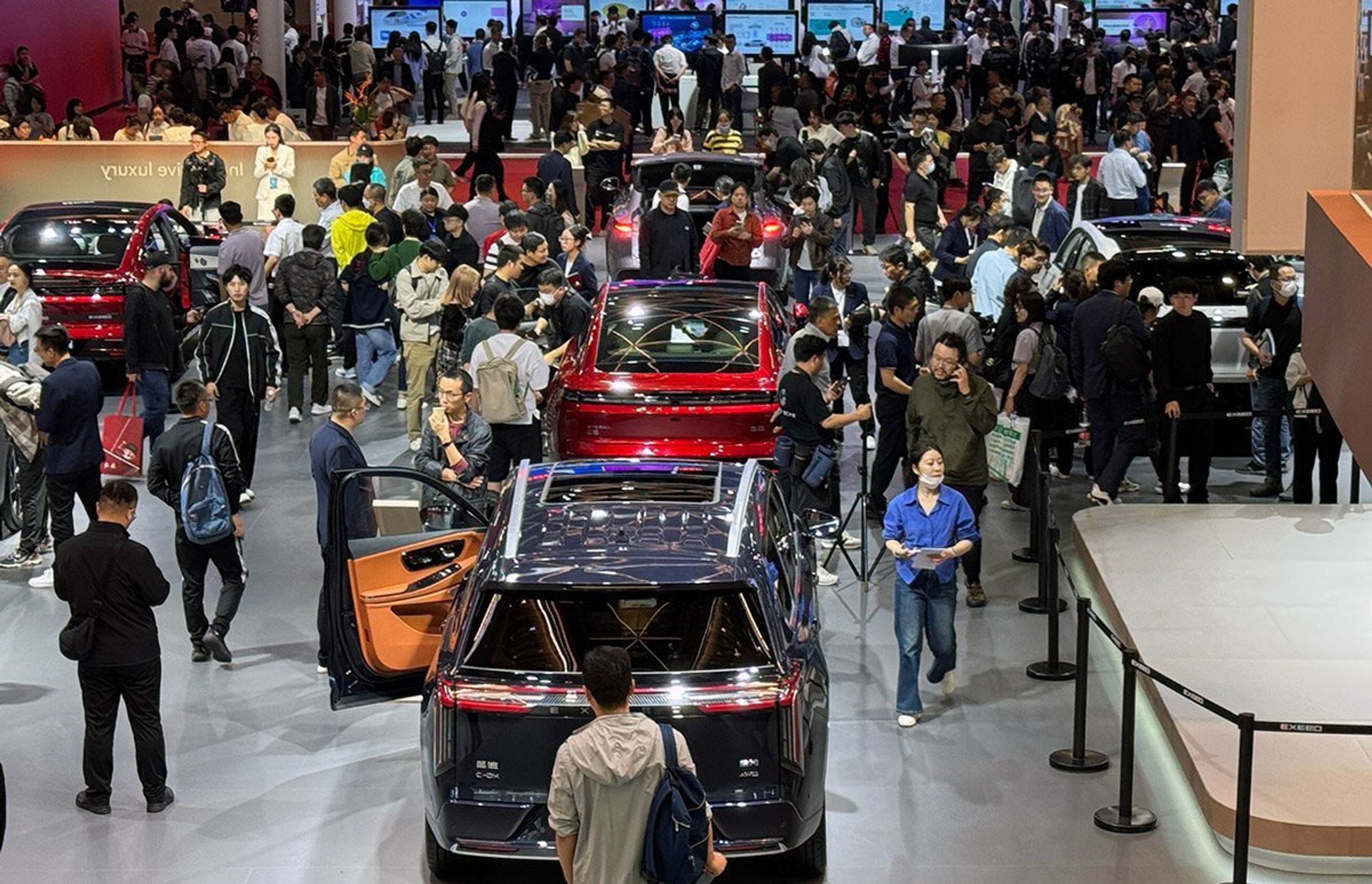 Menneskemylder på biludstilling i Kina.