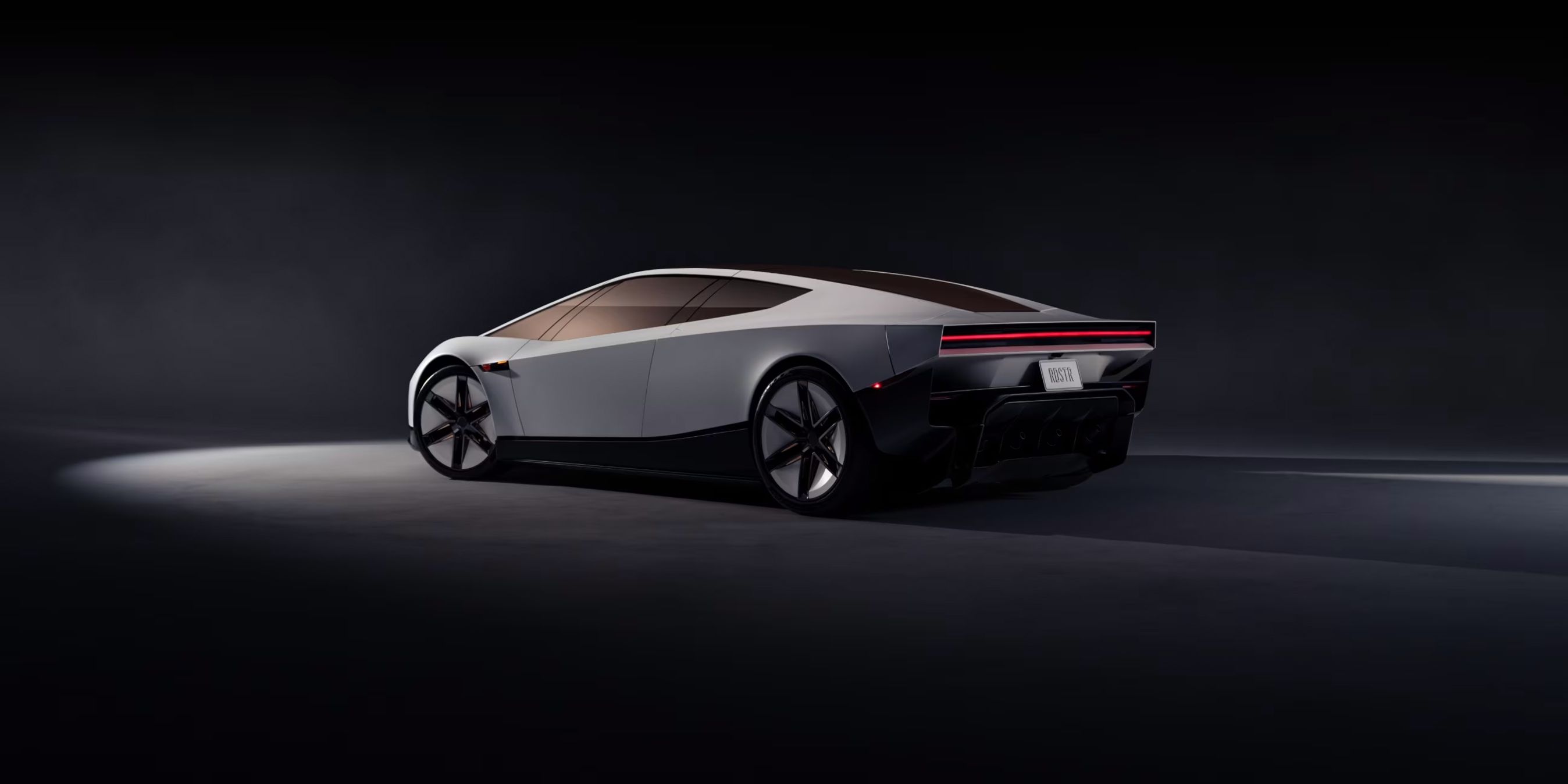 Tesla Roadster bagfra på sort baggrund.