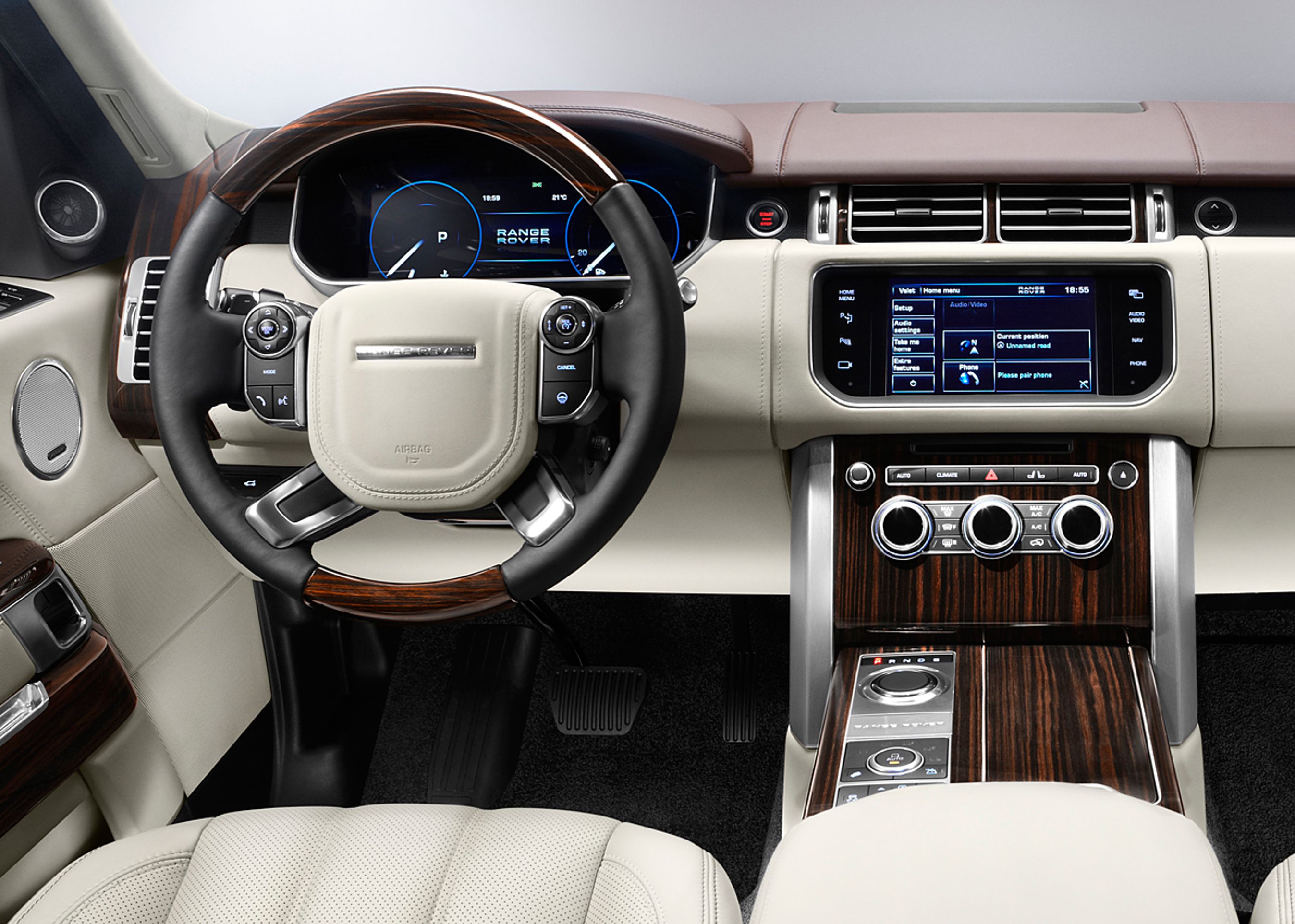 Træfiner og fin læder hører til i en nobel britisk overklasse-SUV. Men dertil er der nu masser af digitale instrumenter.