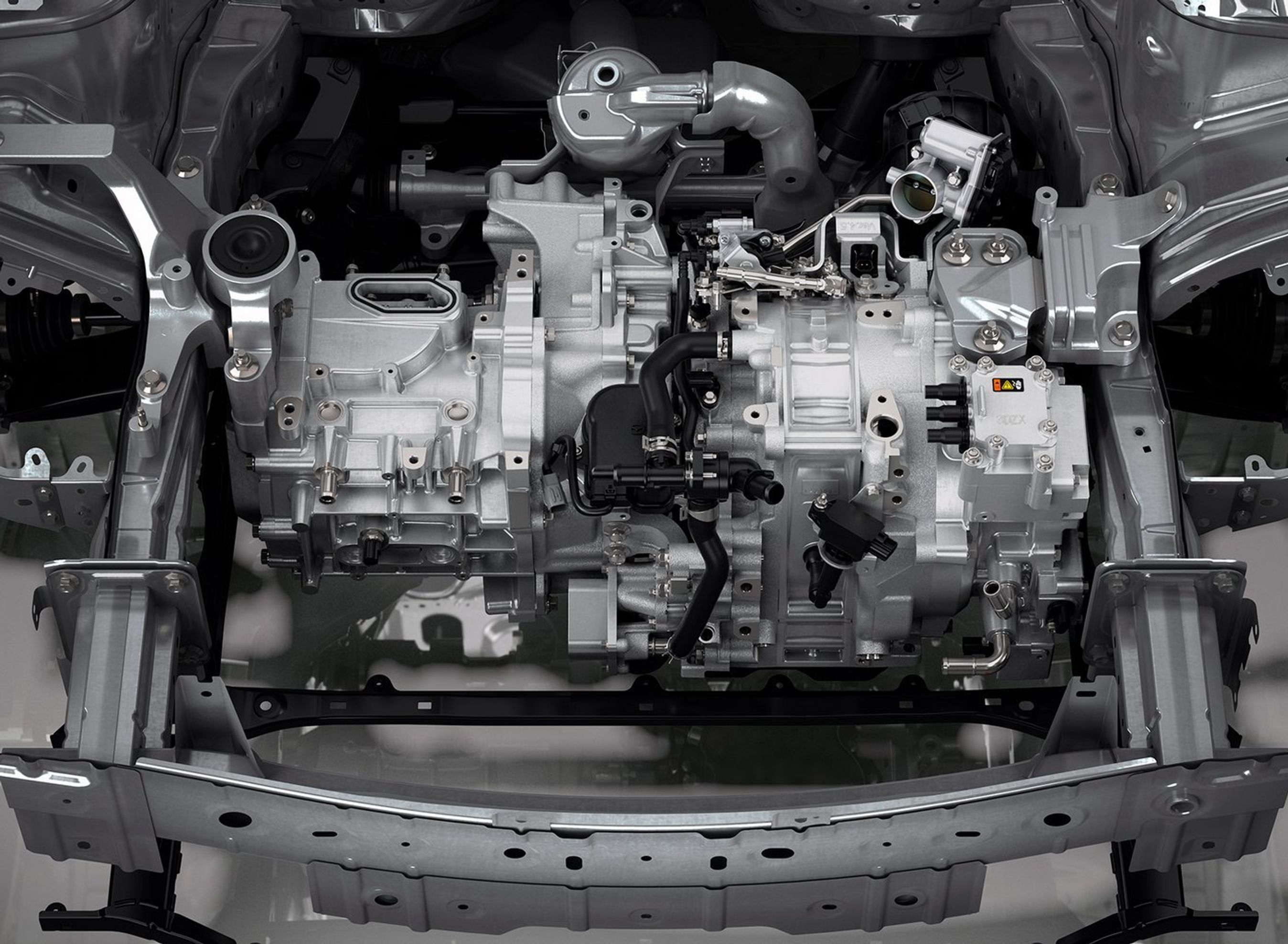 I bunden af motorrummet på MX-30 er der gjort plads til en lille benzinmotor. Den kan tilvælges sidst i 2022.