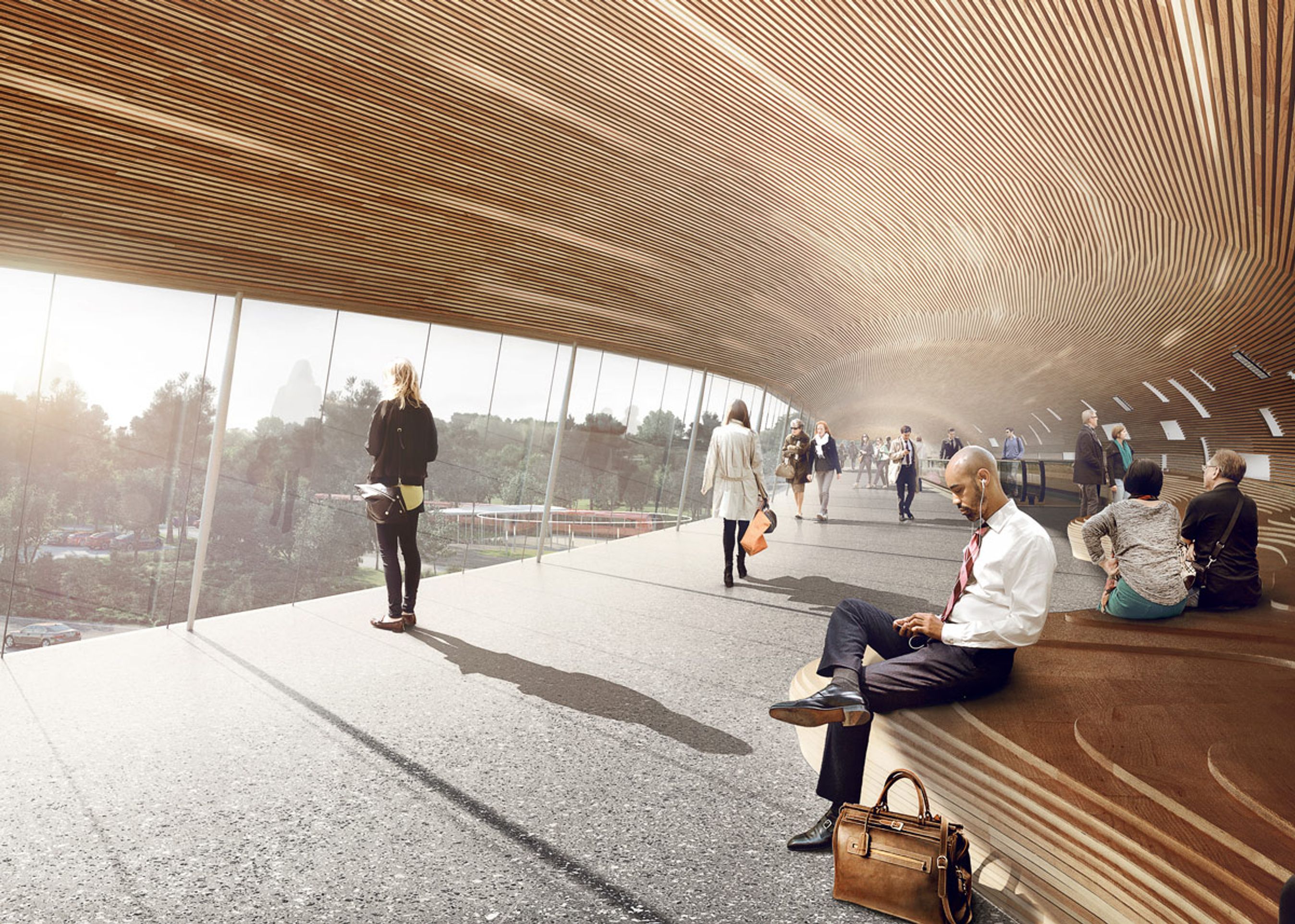 Udsigten fra den lukkede gangbro ud over motorvejen. Den markante station er tegnet af Cobe & Dissing+Weitling.