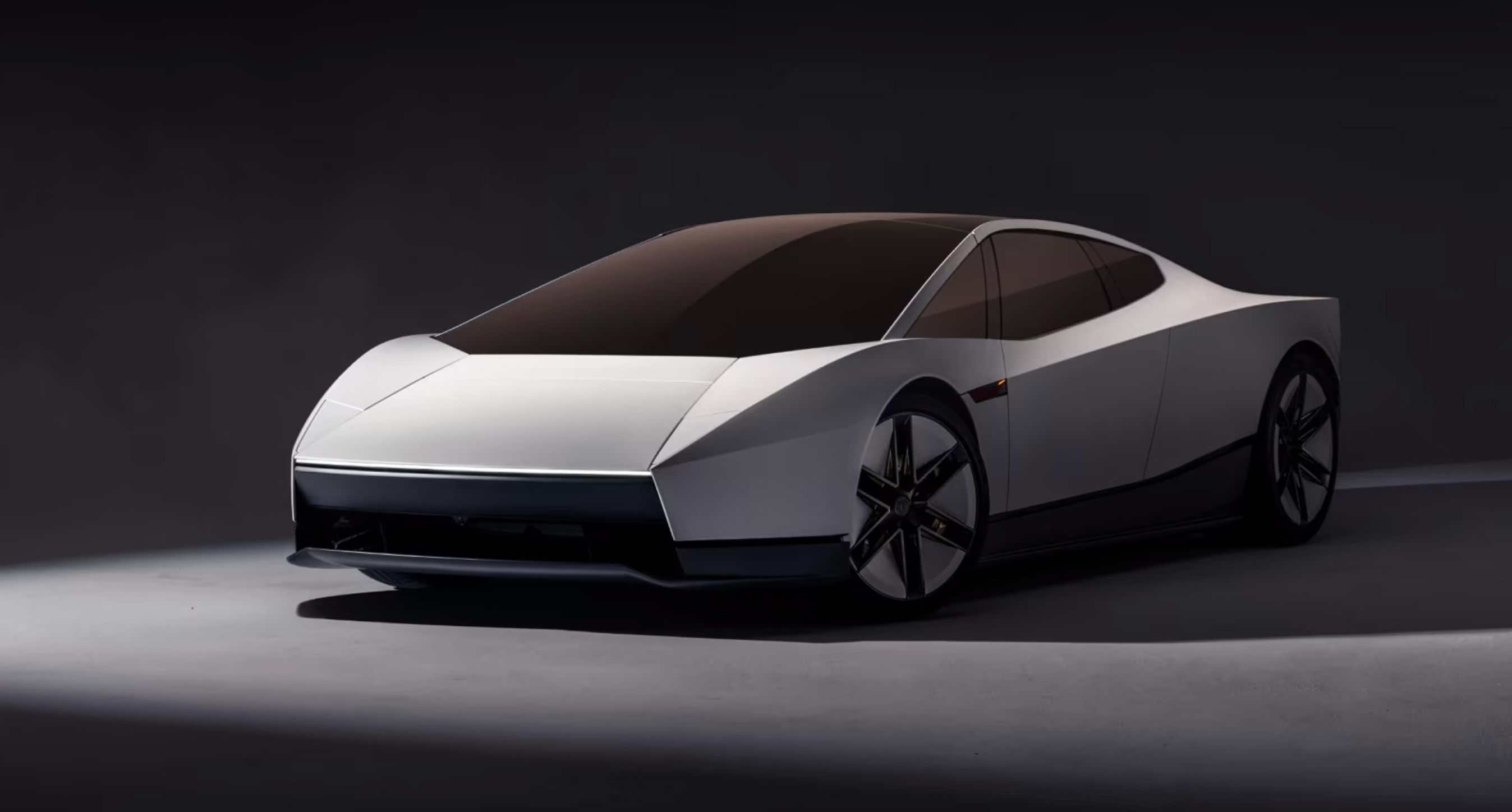 Tesla Roadster forfra på sort baggrund.