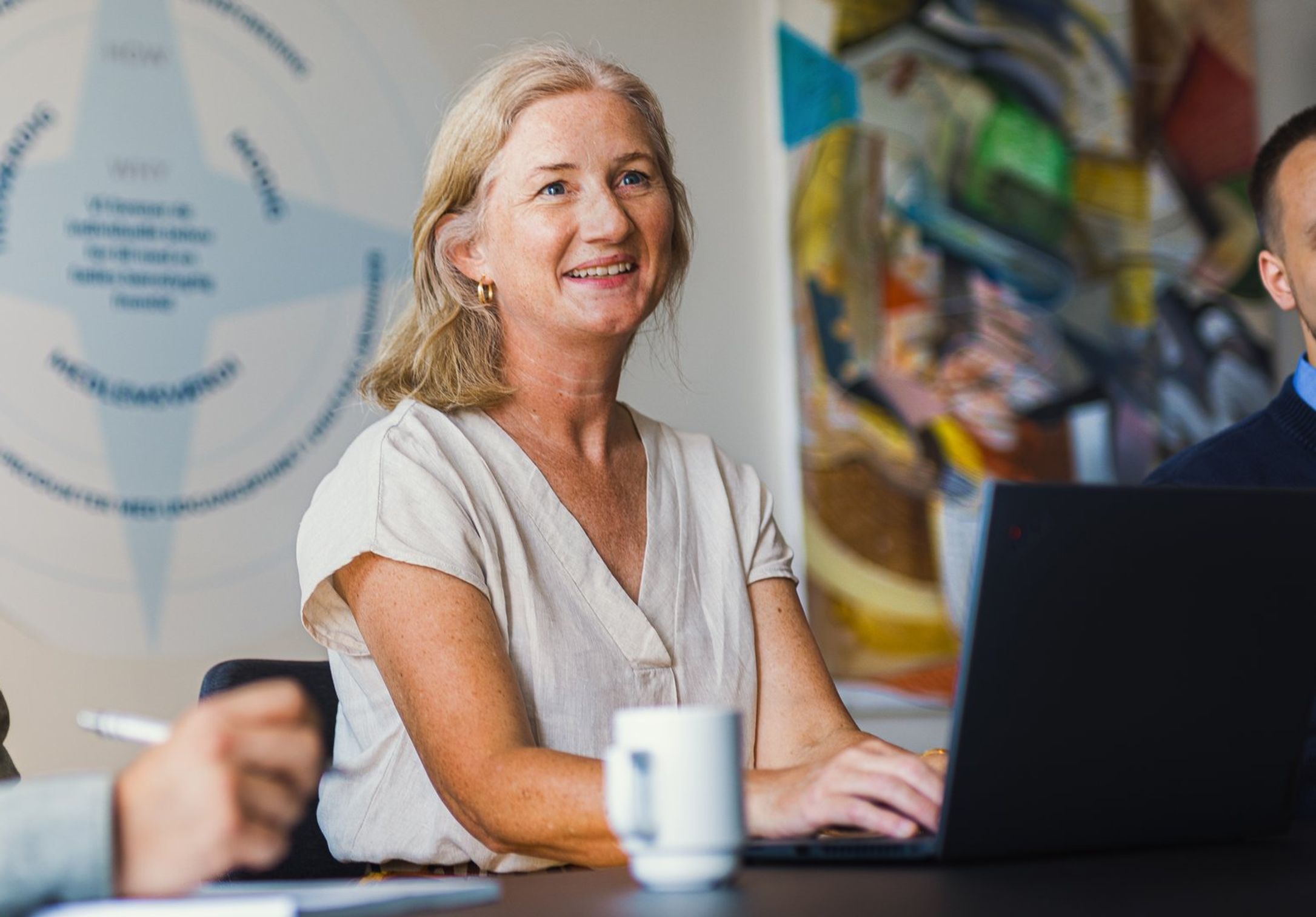 Tre FDM medarbejdere i mødelokale