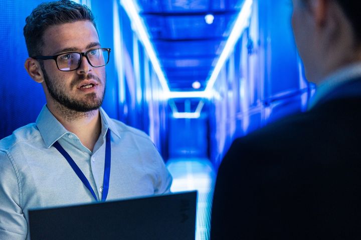 Two IT Professionals talking 