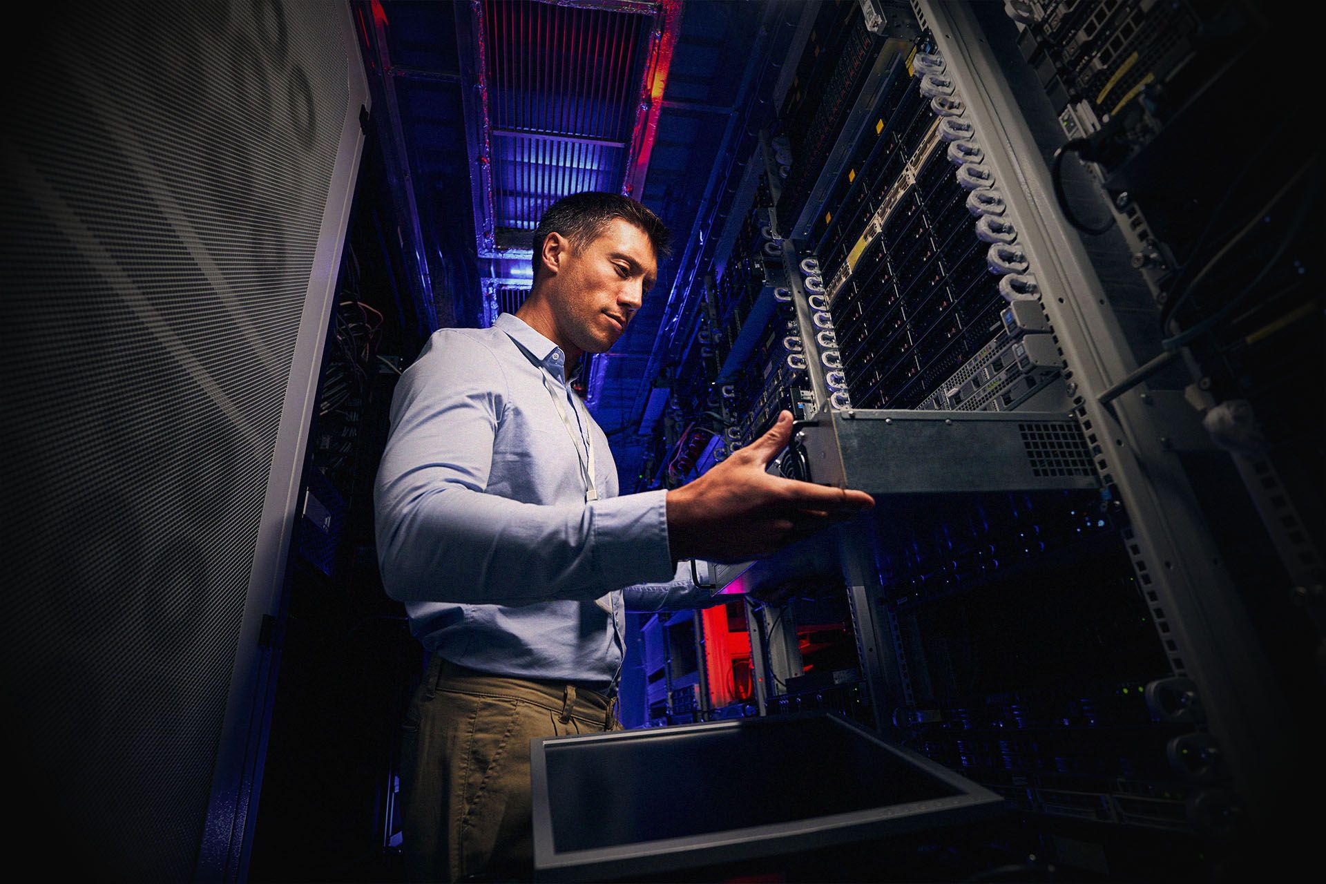 Expert data center IT technician upgrading hardware equipment