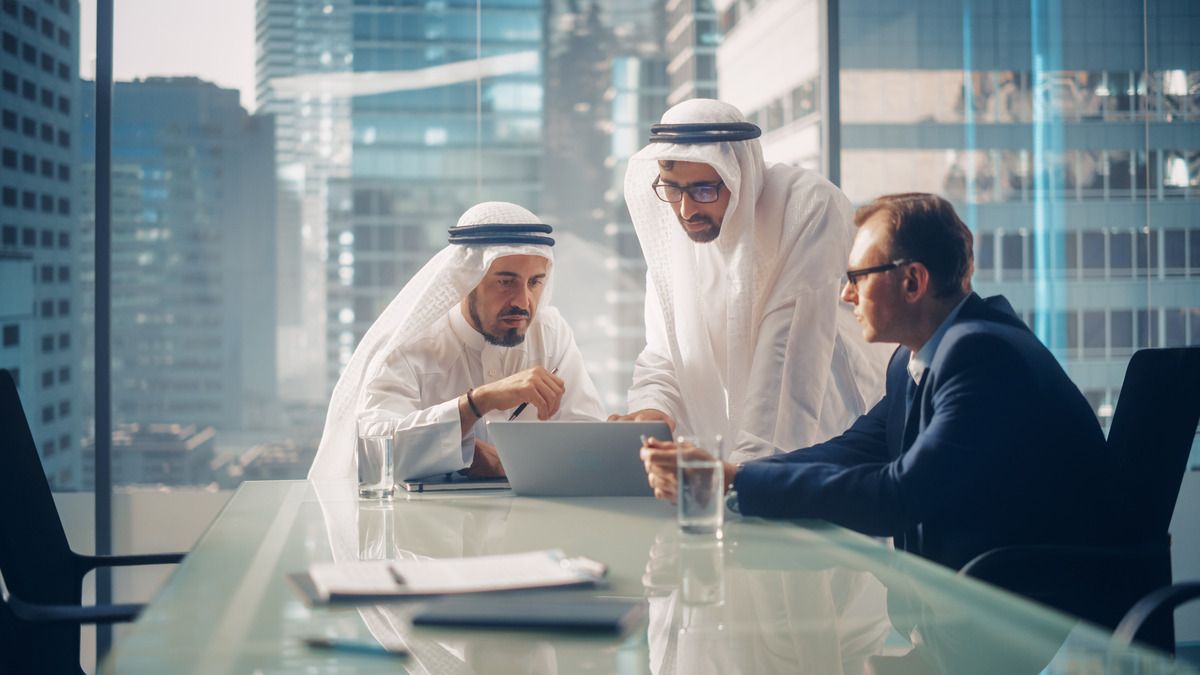 Three colleagues collaborating in office