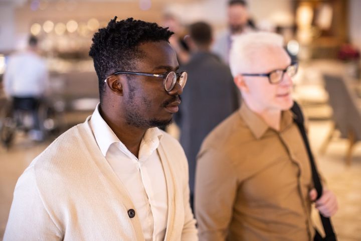 Two diverse professionals at conference