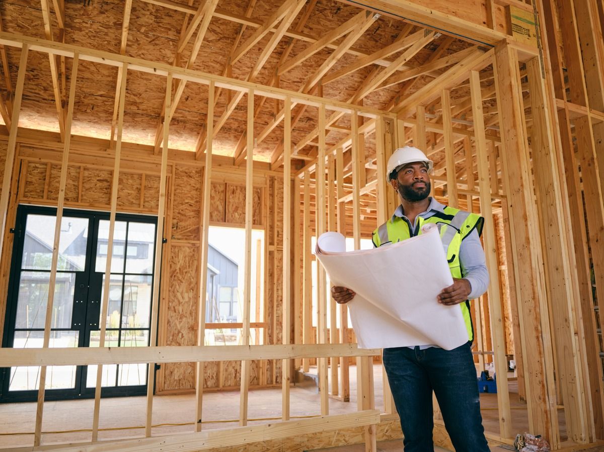 Contractor reviewing plans at build