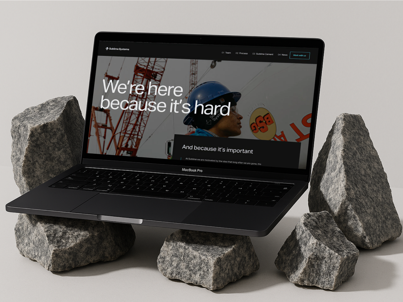 The Sublime Systems website on a laptop propped on raw rock