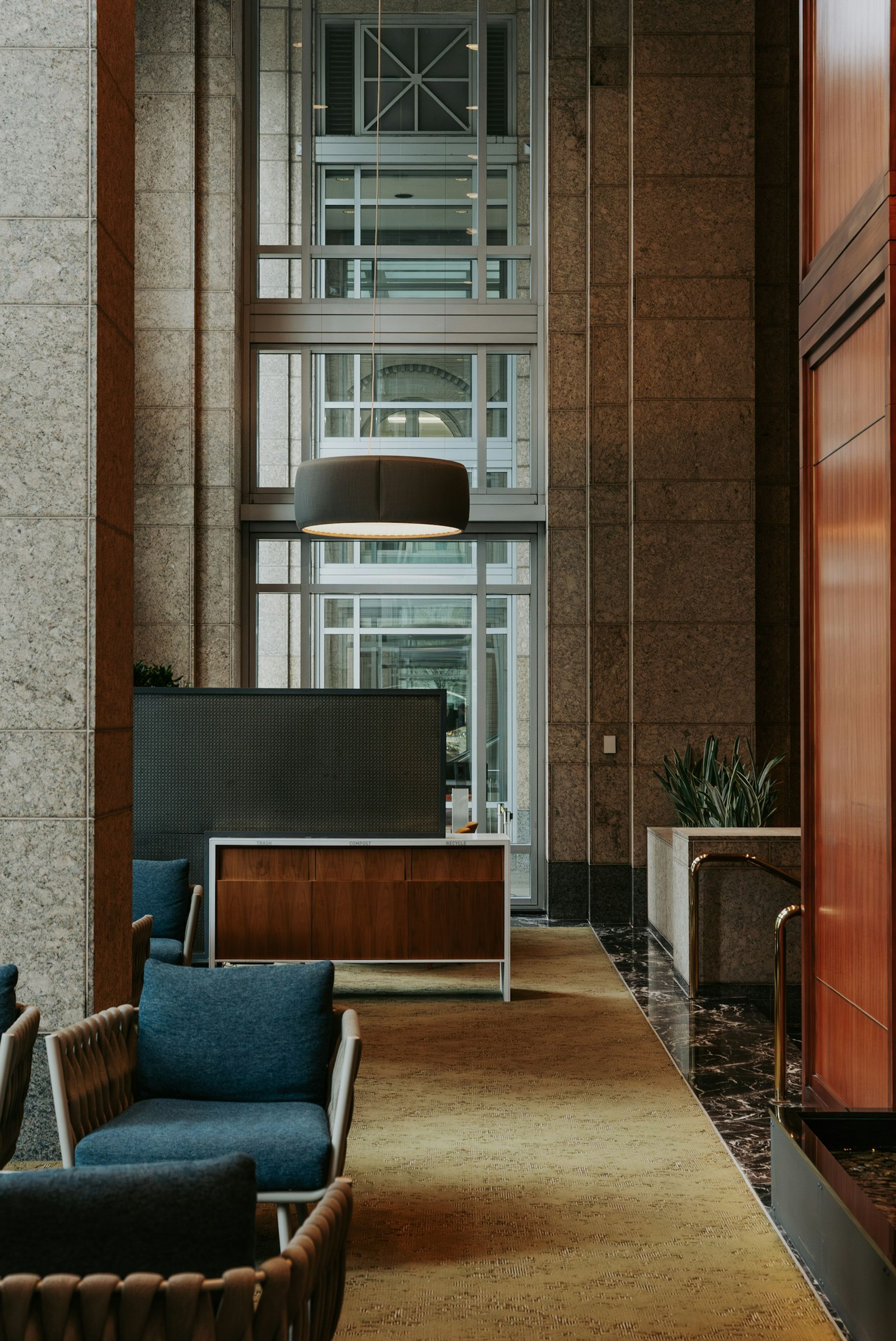 Quiet office lobby with armchairs and warm lighting