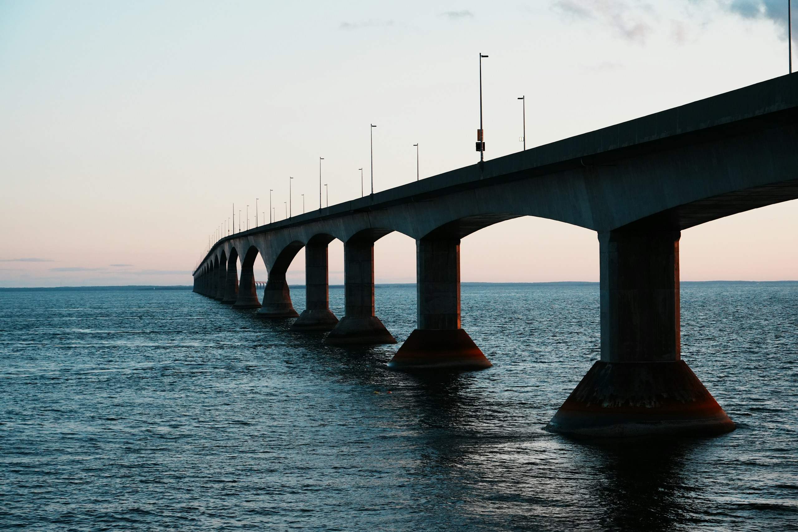 The Confederation Bridge stretching across the Northumberland Strait to Prince Edward Island at dusk