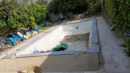 Pool cleared and ready for liner to be removed