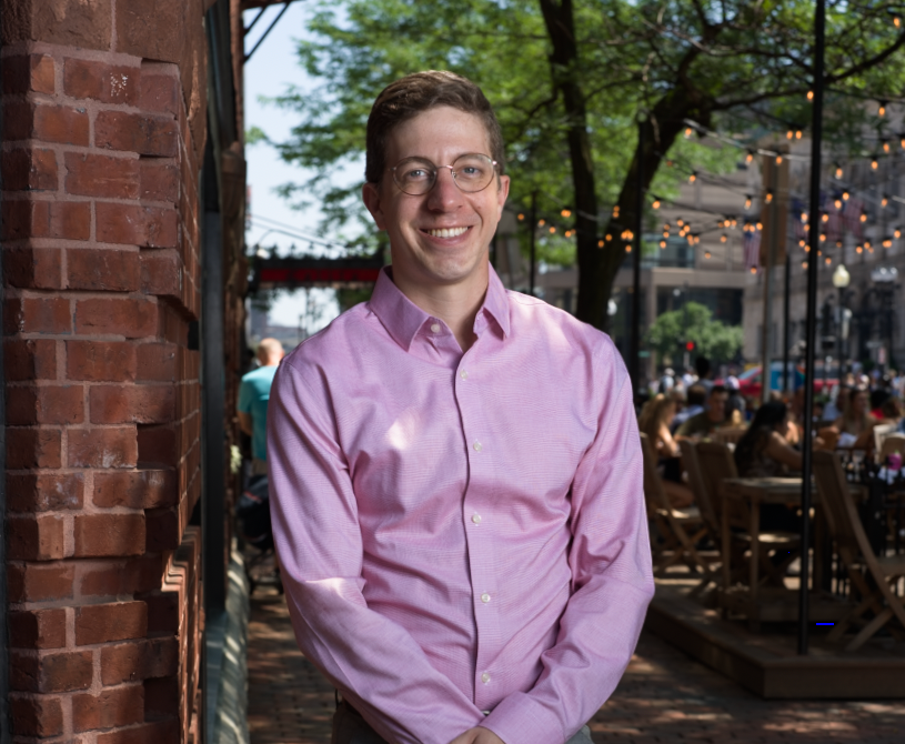 Victor Cohen, MD standing next to a classic Back Bay Boston brick building.